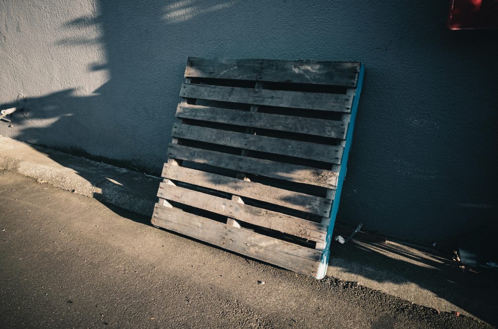 pallet leaning on a wall